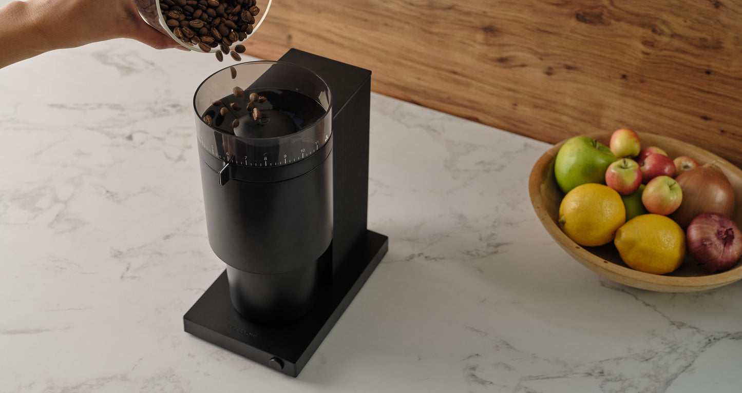 fellow opus conical burr coffee grinder on a kitchen counter